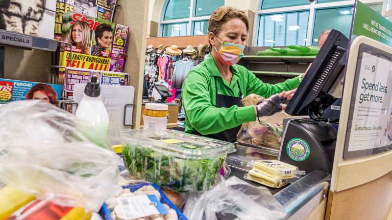 Woman cashier at a supermarket store