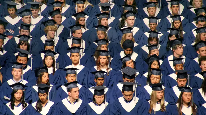 Graduating class in caps and gowns at commencement