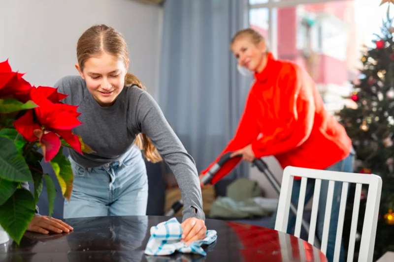 Mom and daughter cleaning up home ahead of Christmas