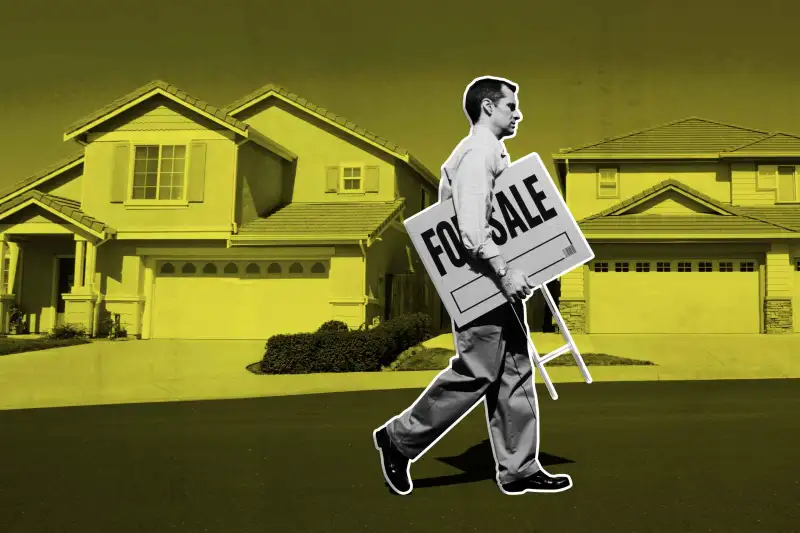 Real estate agent walking in front of house with holding for sale sign, side view