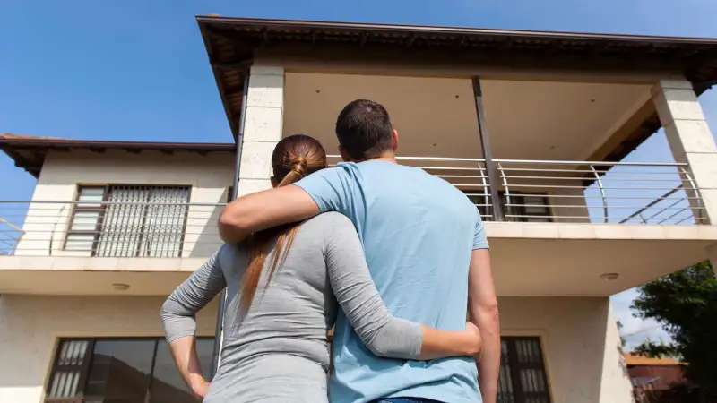 Couple looks at a house they are about to buy