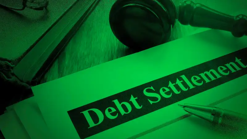 Debt Settlement documents and gavel in the court.