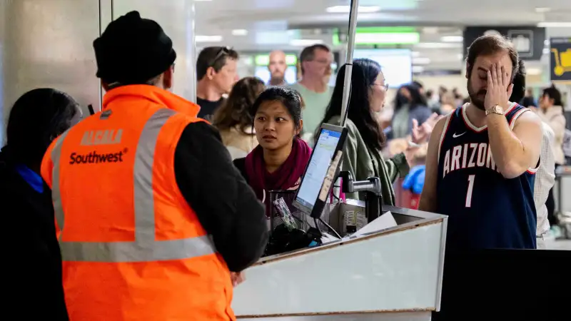 Editorial photo of frustrated travelers using Southwest Airlines getting stranded on the airport due to cancelled flights