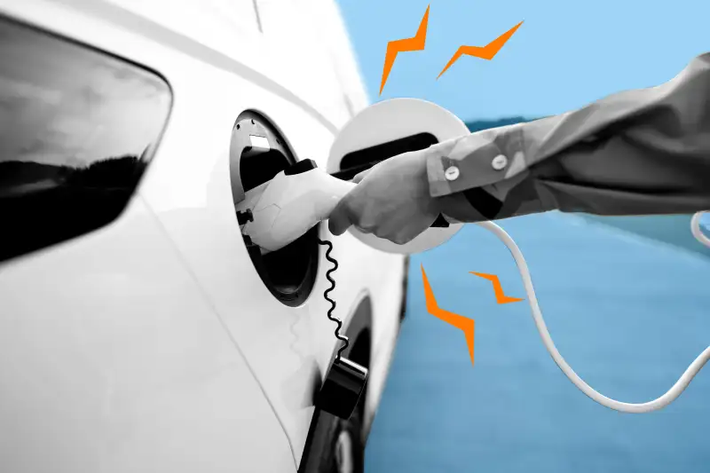 Close-up of a person charging their electric car