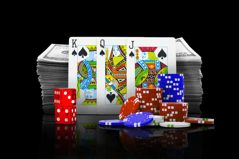 Photo Collage of a stack of hundred dollar bills with a stack of casino chips, a pair of dice and some playing cards