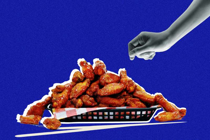 Photo collage of a hand reaching for a chicken wing on a plate, with a blue background blue