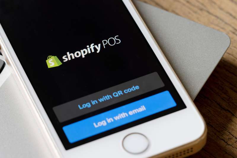 Close-up of a smartphone with the Shopify POS application