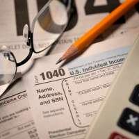 Filing taxes on IRS Form 1040 close-up view