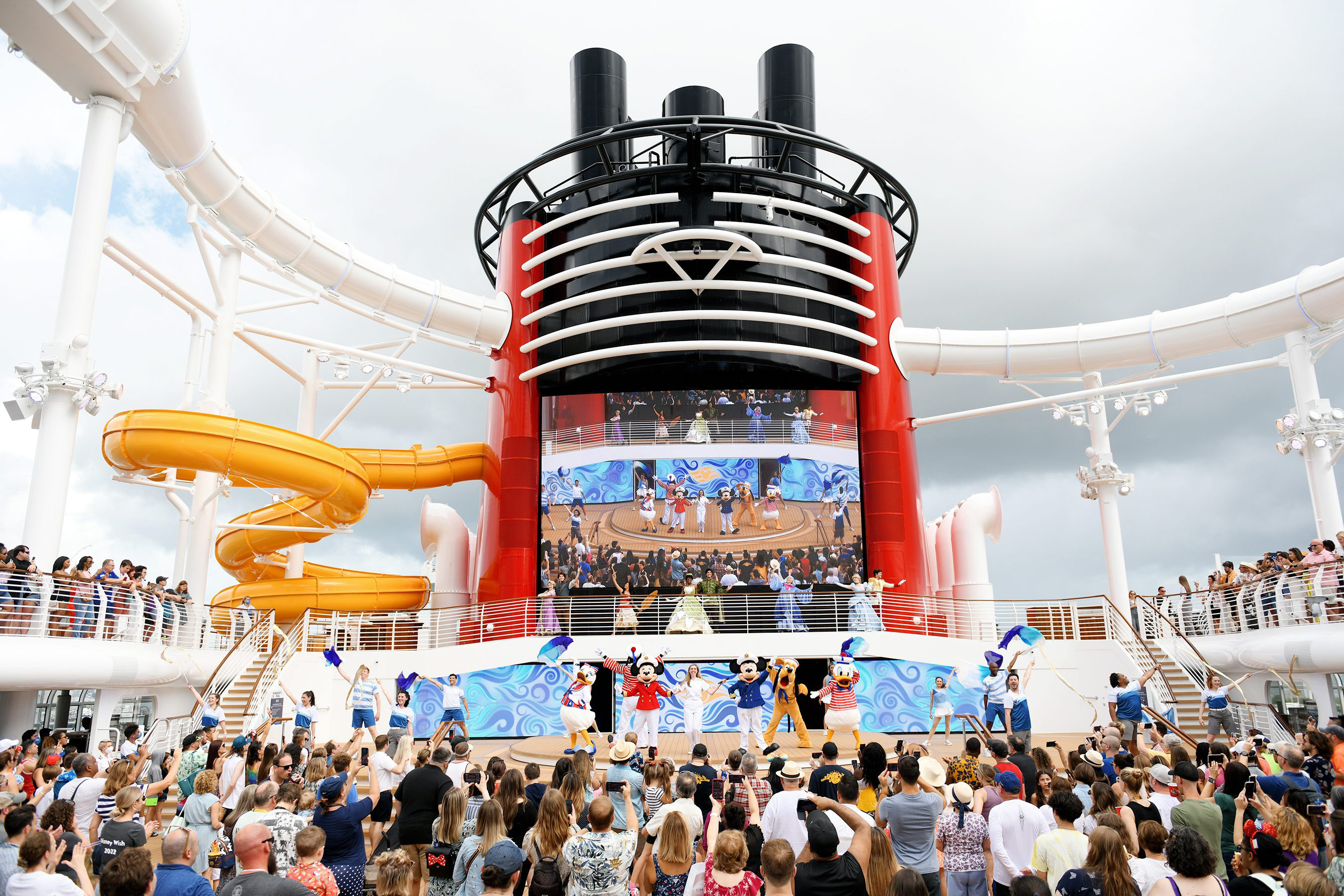 Kids and family enjoying a show at Disney Cruise Lines