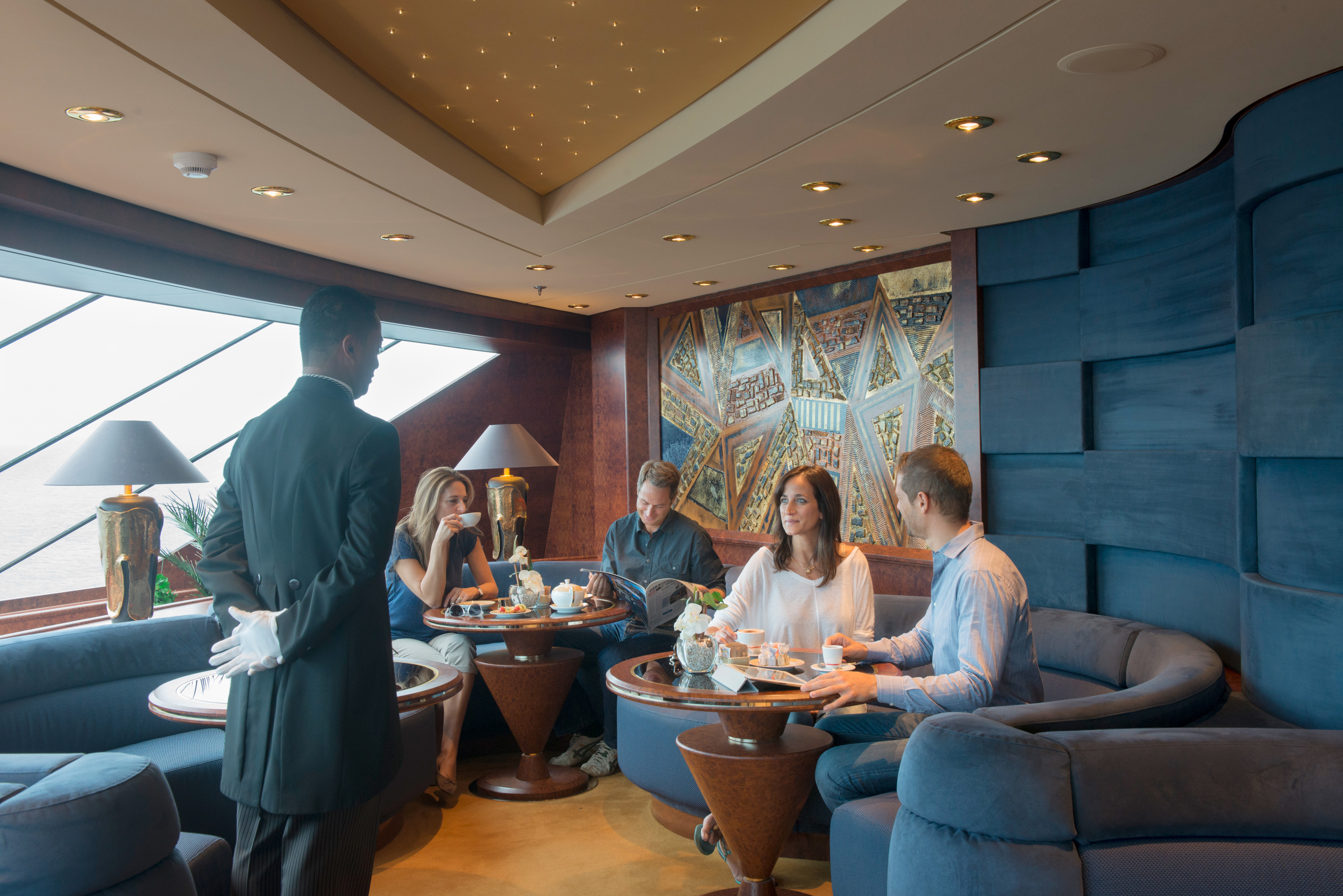 People enjoying coffee at a Yacht Club MSC cruises
