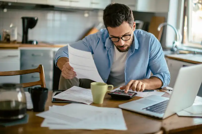 Photo of a man going through his financials problems