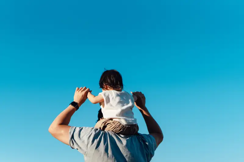 Man piggybacking a child