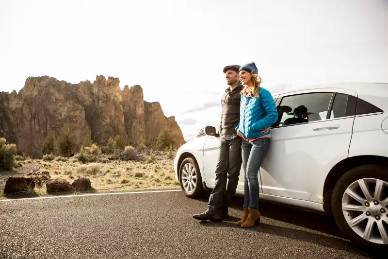 A couple taking in the view from a scenic overlook.