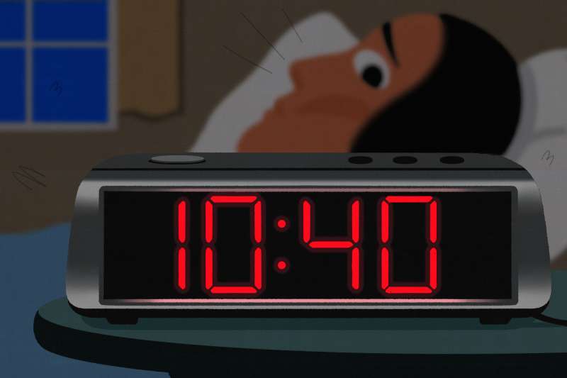 Illustration of a digital clock showing 10:40 pm with a person awake in bed in the background