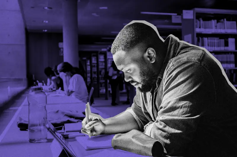 Man studying at school library