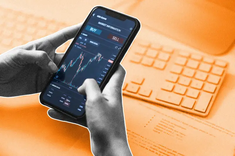 Close-up Shot of a Persons Hands Holding a Smartphone with a Stock Market Graph on Screen