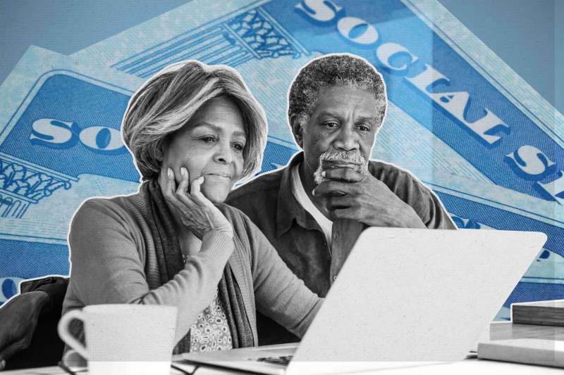 Senior African American couple using laptop, contemplating with oversized social security cards behind them