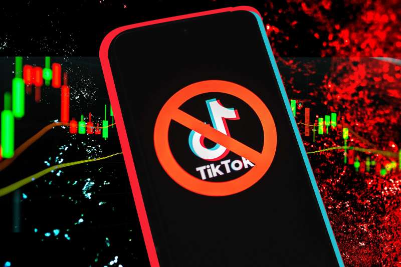 TikTok app logo crossed out with red ban sign displayed on phone screen over textured background with stocks graphics