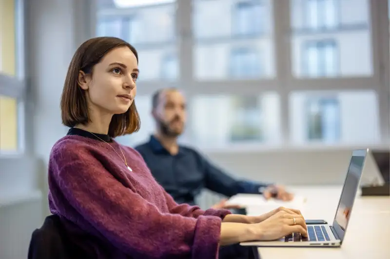 Intern Woman working on her computer