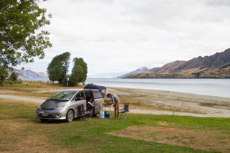 A car camping by the lake
