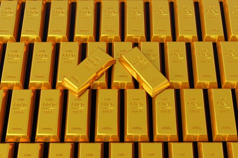 Close-up of multiple gold bars stacked next to each other