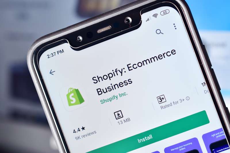 Close-up of a smartphone with the Shopify application logo