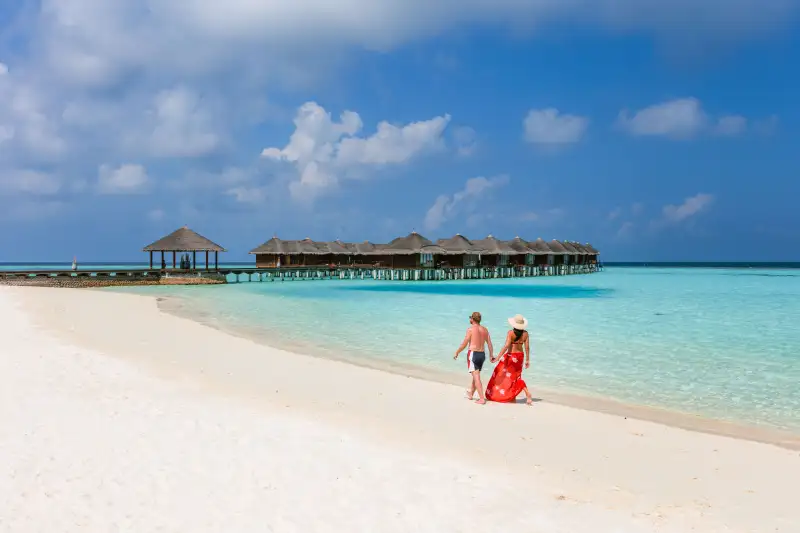 Couple walking on a beautiful beach