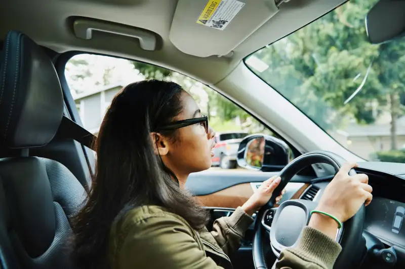 Young woman driving a car