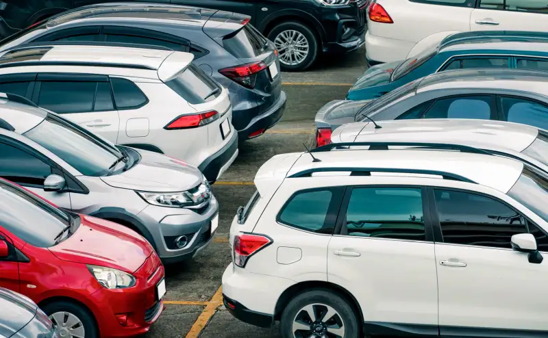 Aerial view of multiple cars in a parking lot