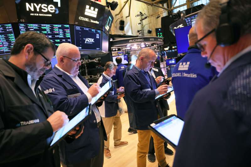 Traders work on the floor of the New York Stock Exchange during morning trading on May 17, 2023 in New York City