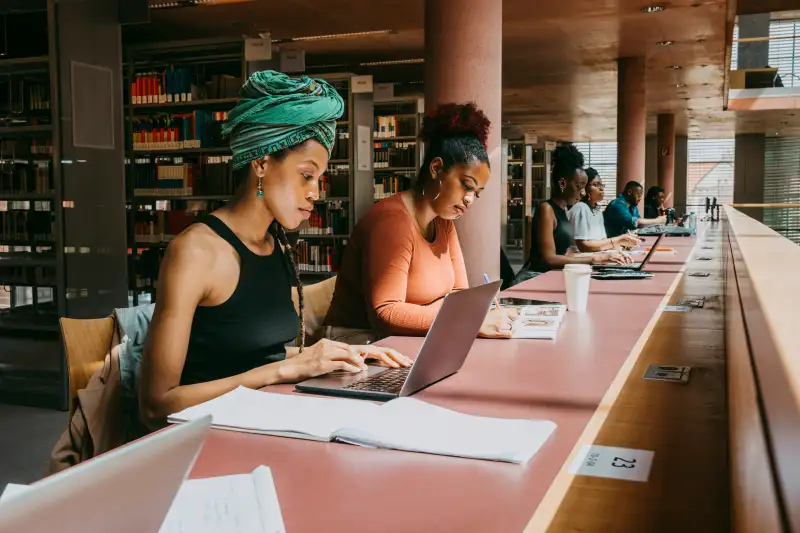 College students studying at a library