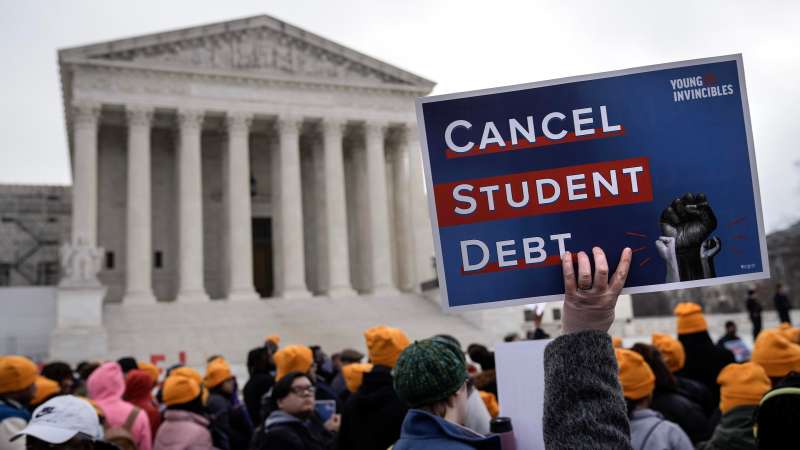 News photo of people protesting for the government to take action against student debt