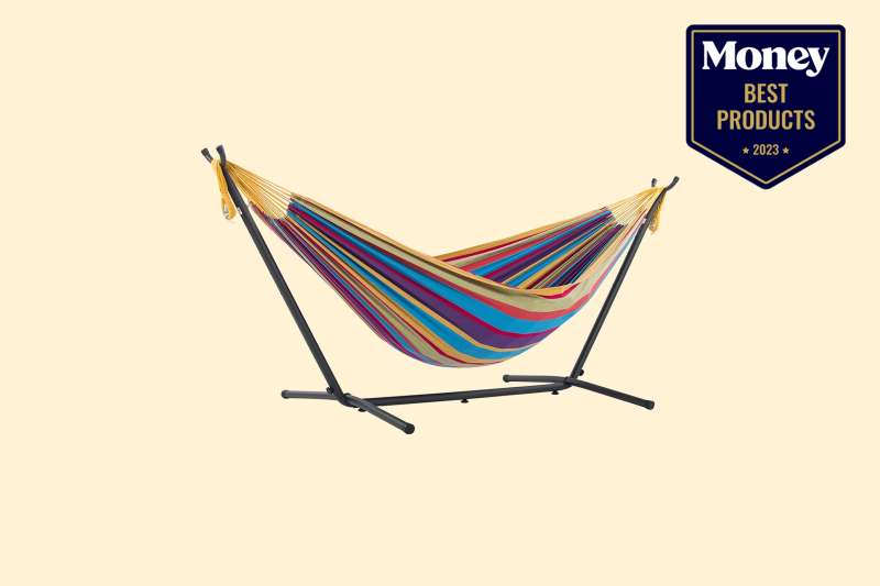multi-colored hammock with a stand on a yellow backdrop