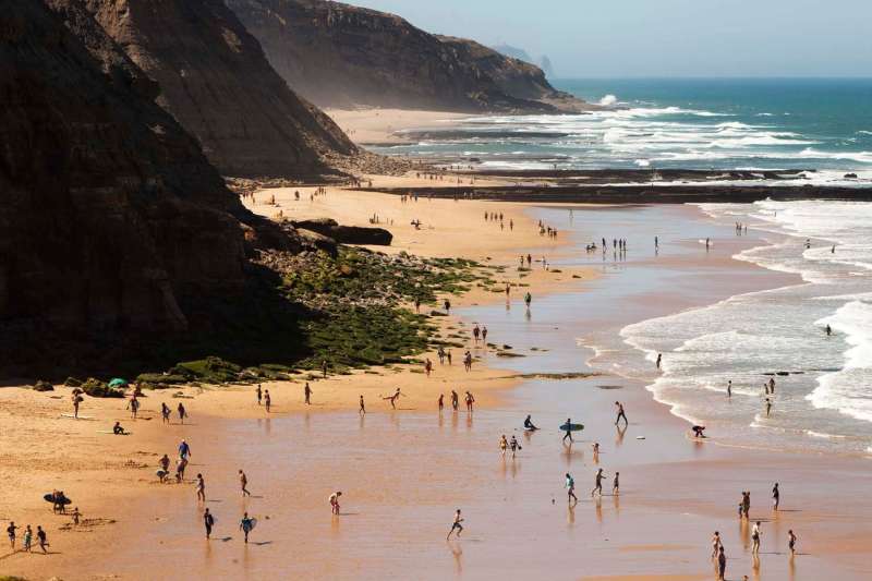 Aerial view of people at Ericeira Beach in Portugal