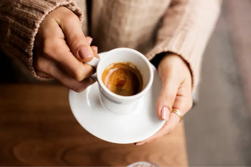 Coffee Cup, Lady's hands holding Coffee Cup, Woman holding a white mug,