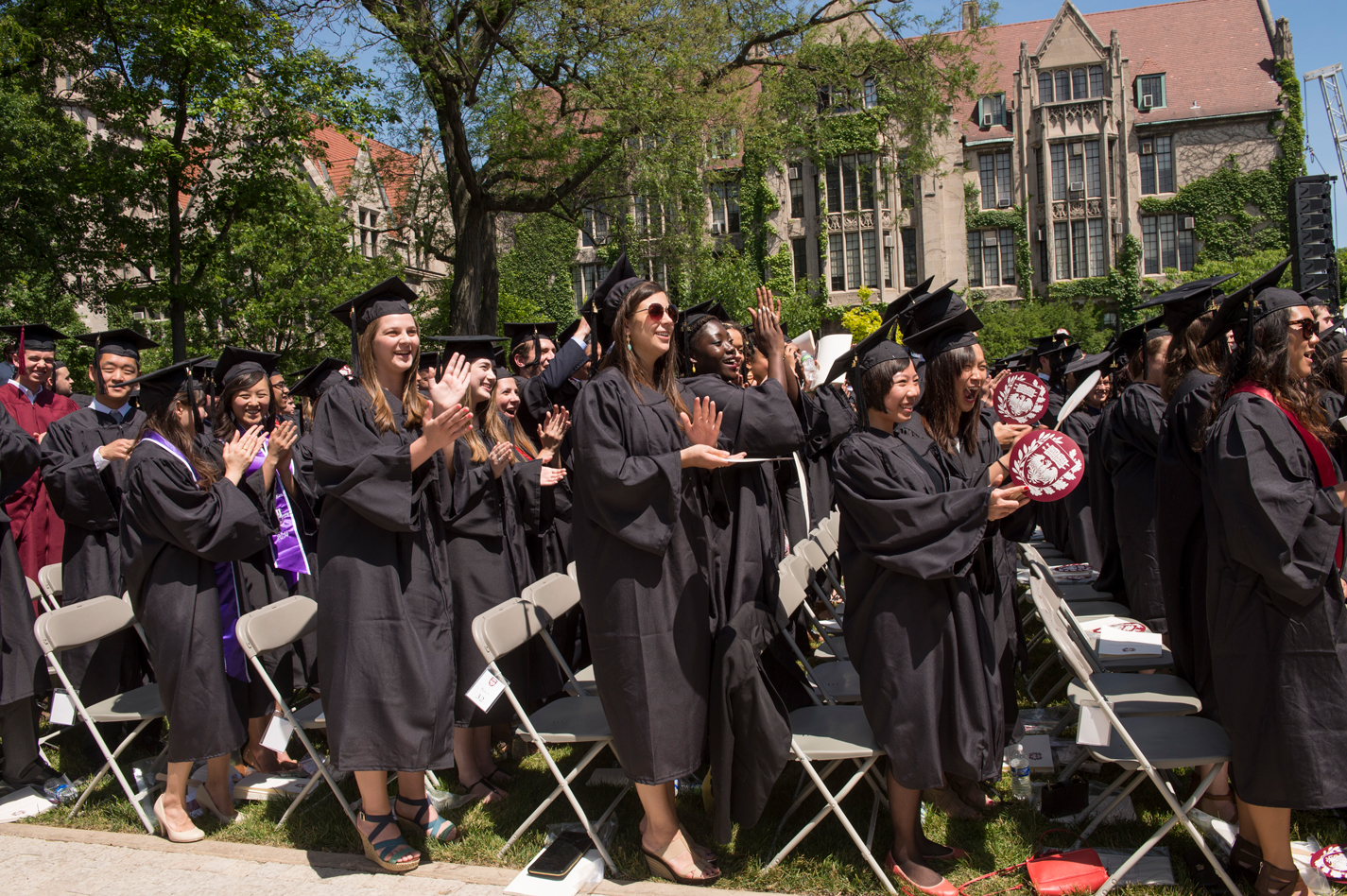 Students clapping during a graduation ceremony at The University of Chicago