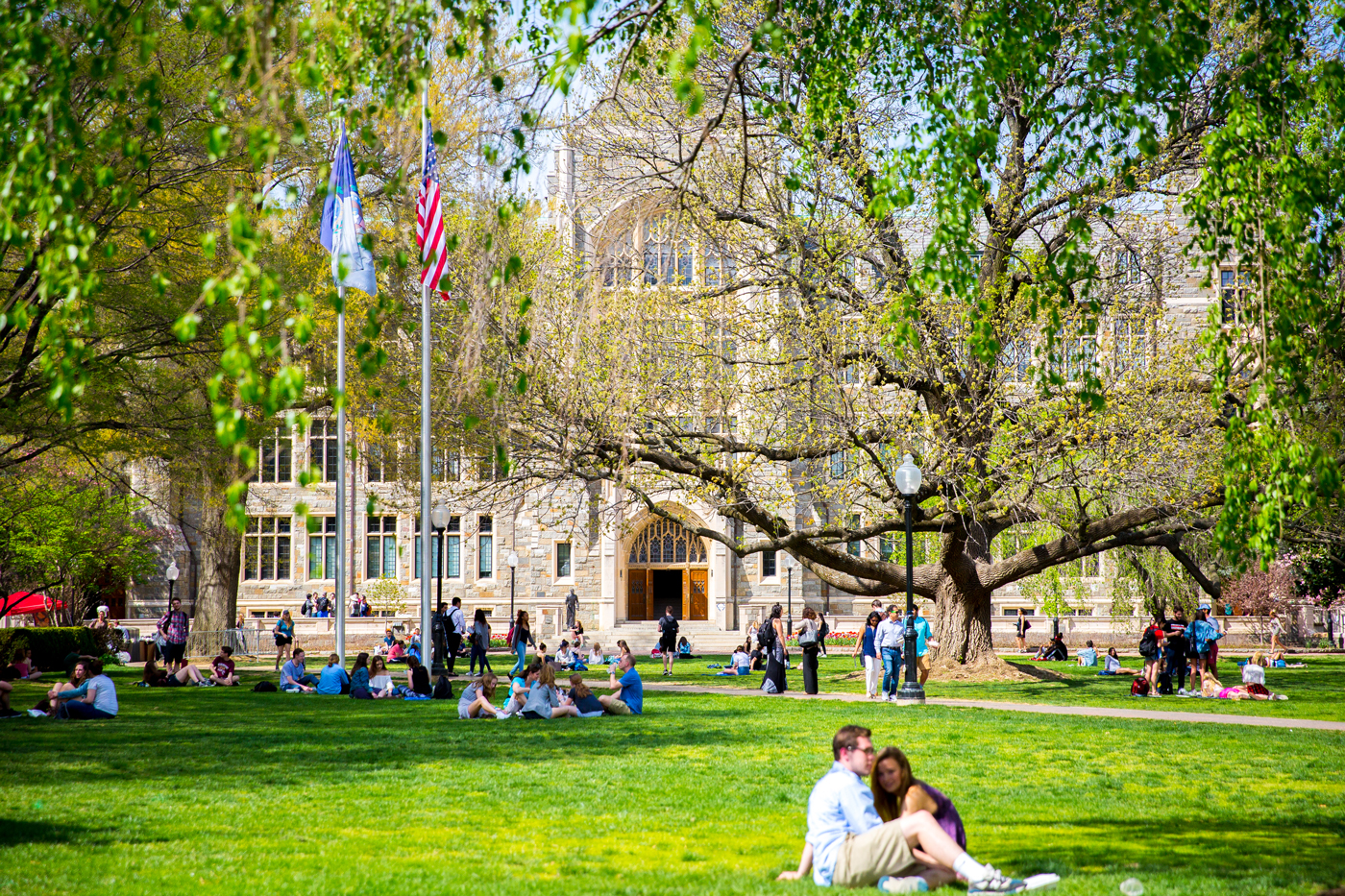 People enjoying a beautiful day on the lawn at the Georgetown University campus