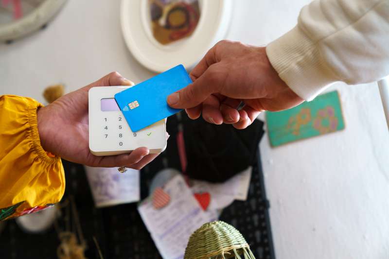 Person making a Payment With a Credit Card