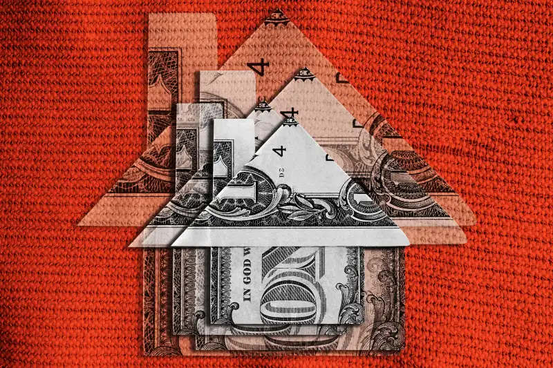 Photo Collage of multiple dollar bills folded up to look like a small house, stacked on top of each other in decreasing sizes