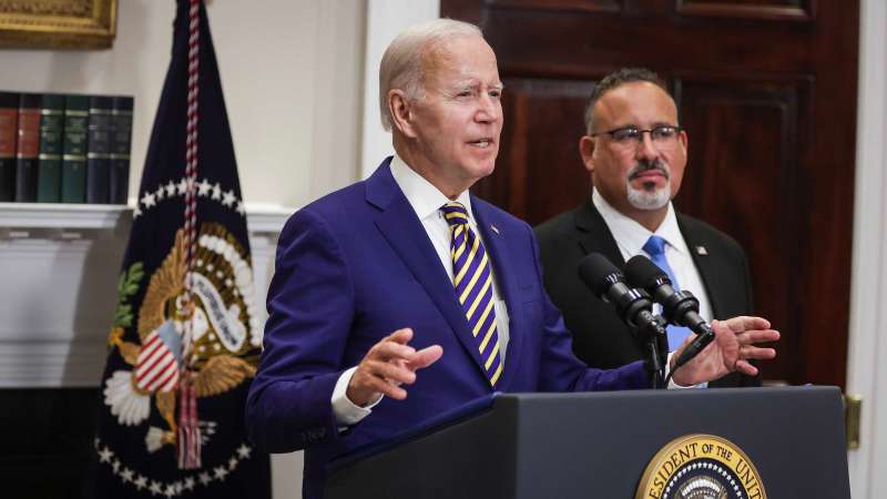 U.S. President Joe Biden speaks on the student debt relief plan with Secretary of Education Miguel Cardona