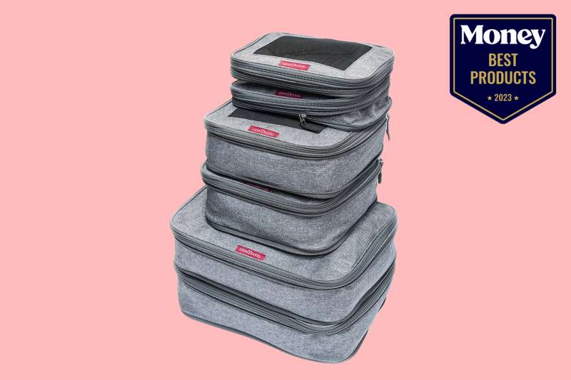 Best Compression Packing Cubes in grey color stacked on a pink backdrop