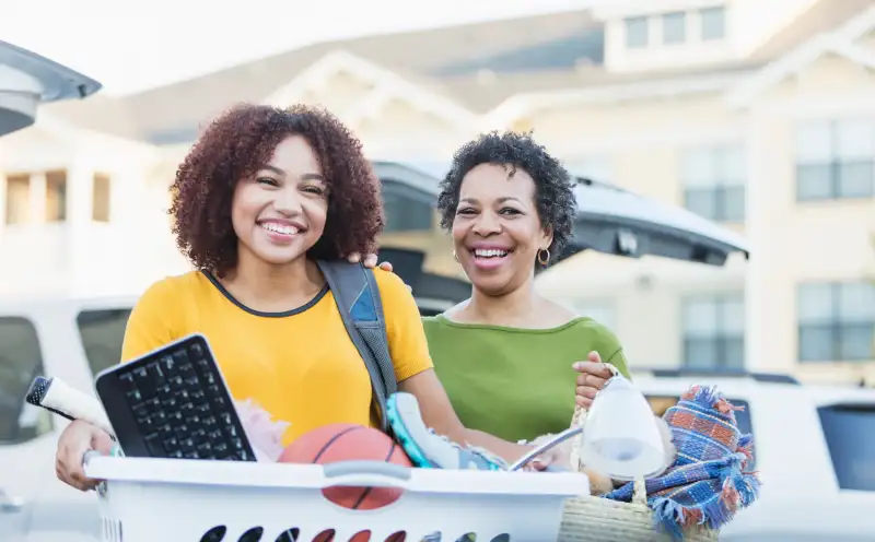 African-American mother helping daughter move