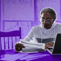 Older woman in her house, looking through paperwork