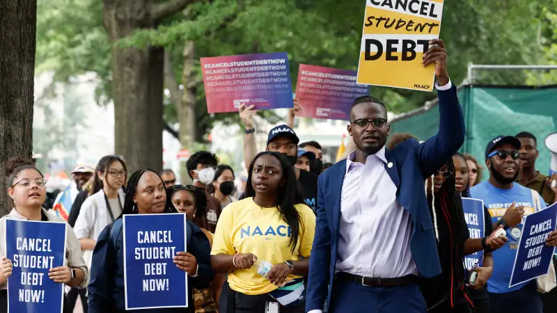 People for student debt relief demonstrate in front of the White House