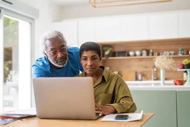 Couple looking over their finances together.