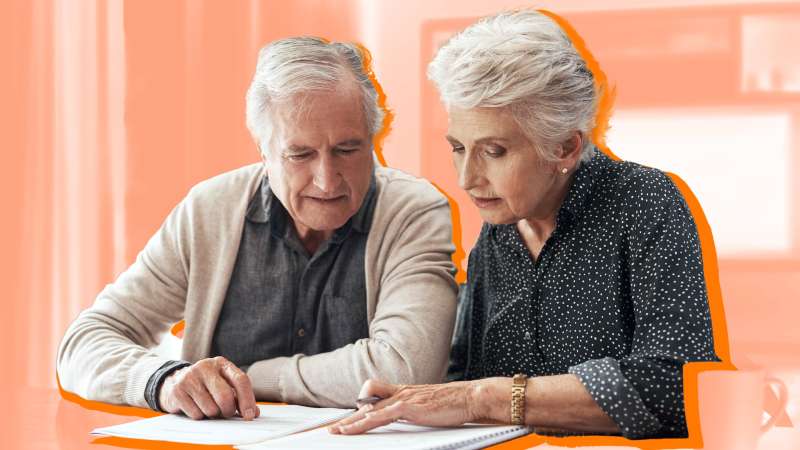 Senior couple look over insurance plans together
