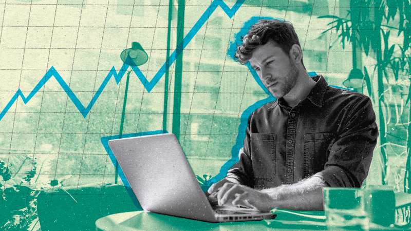 Photo illustration of a young investor using his laptop