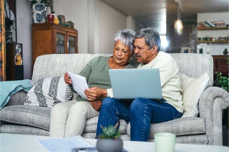Older couple review their insurance together.