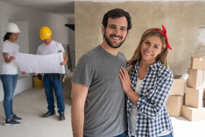 Portrait of a happy couple remodeling their house