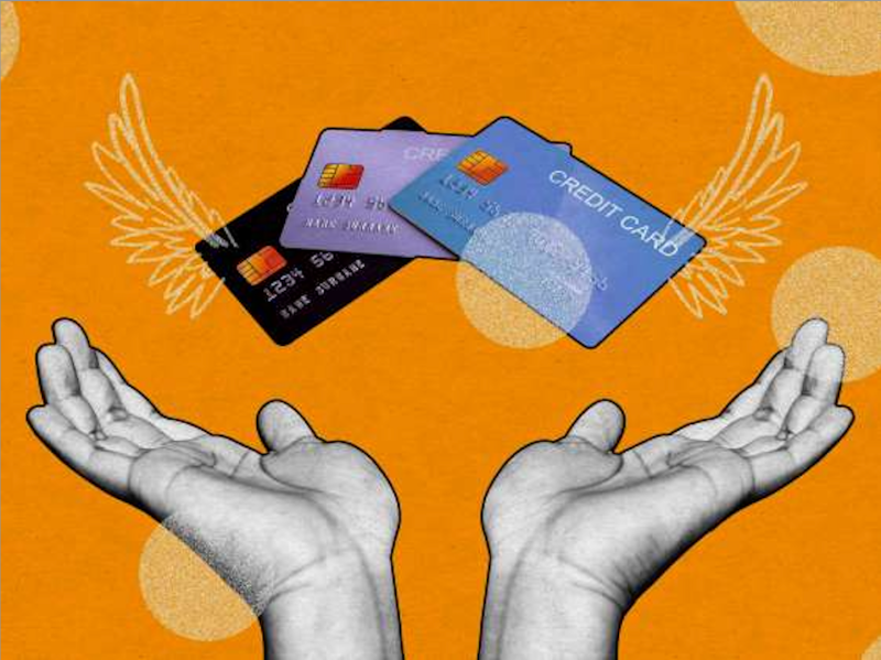 Hands and credit cards with wings